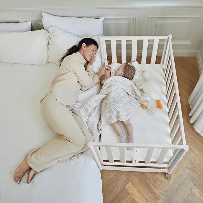 EvoNook 6-in-1 Convertible Mini Crib, 100% New Zealand Solid Wood, 4 Adjustable Mattress Heights, Crib with Mattress, White