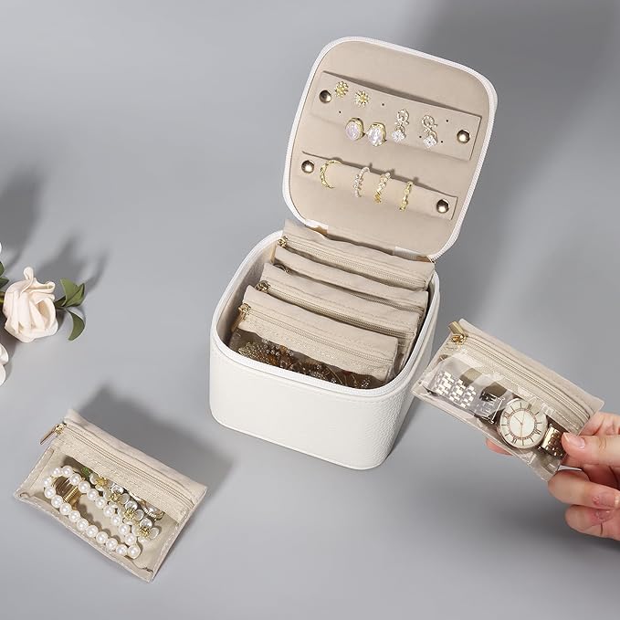 DesignSter Small Jewelry Box, Travel Small Jewelry Organizer with Earring Tray and Ring Holder, Square Travel Jewelry Storage Case with 6 Velvet Jewelry Pouches, Beige