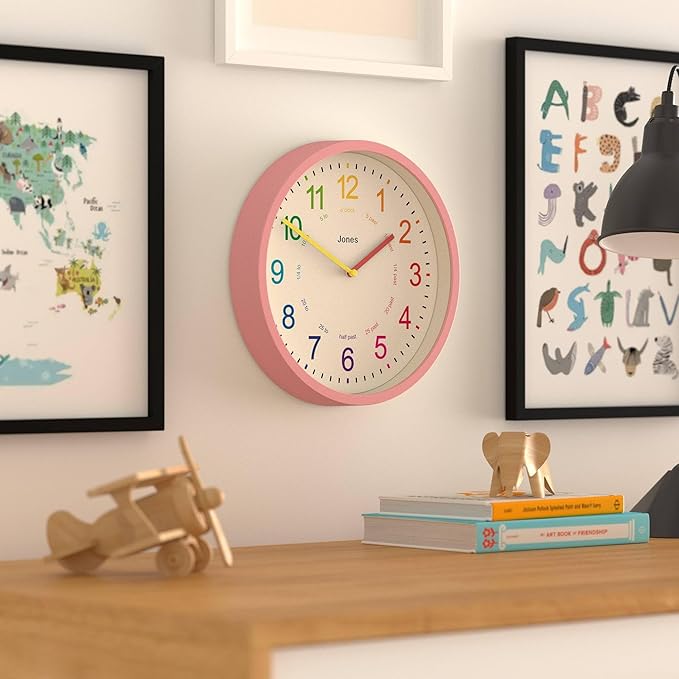JONES CLOCKS® Kids Wall Clock | Small Modern Children’s Clock | 10 inch | Pink | Colourful Numbers | Learn to Tell The time