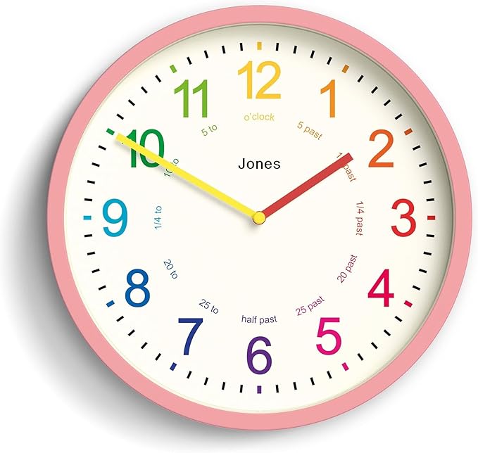 JONES CLOCKS® Kids Wall Clock | Small Modern Children’s Clock | 10 inch | Pink | Colourful Numbers | Learn to Tell The time
