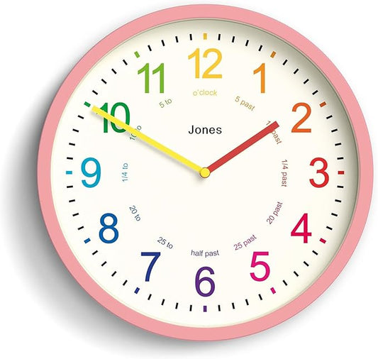 JONES CLOCKS® Kids Wall Clock | Small Modern Children’s Clock | 10 inch | Pink | Colourful Numbers | Learn to Tell The time