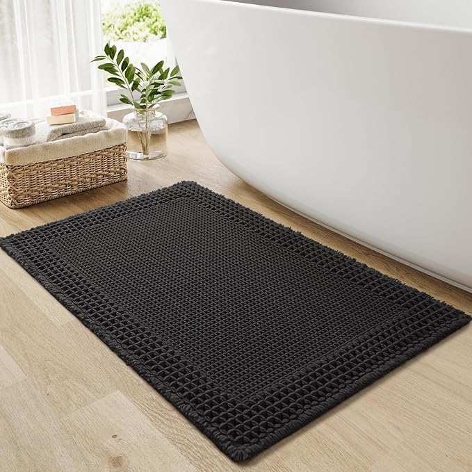 RESARE Waffle Bath Mat for Bathroom, Super Absorbent Bathroom Rugs Non Slip Machine Washable, Ultra Soft Quick Dry Boho Bath Rugs with Tassels for Floor, Upgraded Bordered Design, 18"x30" Black