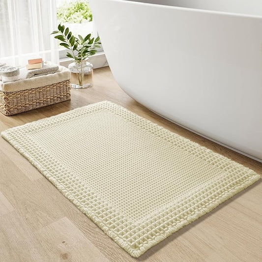 RESARE Waffle Bath Mat for Bathroom, Super Absorbent Bathroom Rugs Non Slip Machine Washable, Ultra Soft Quick Dry Boho Bath Rugs with Tassels for Floor, Upgraded Bordered Design, 24"x36" Cream