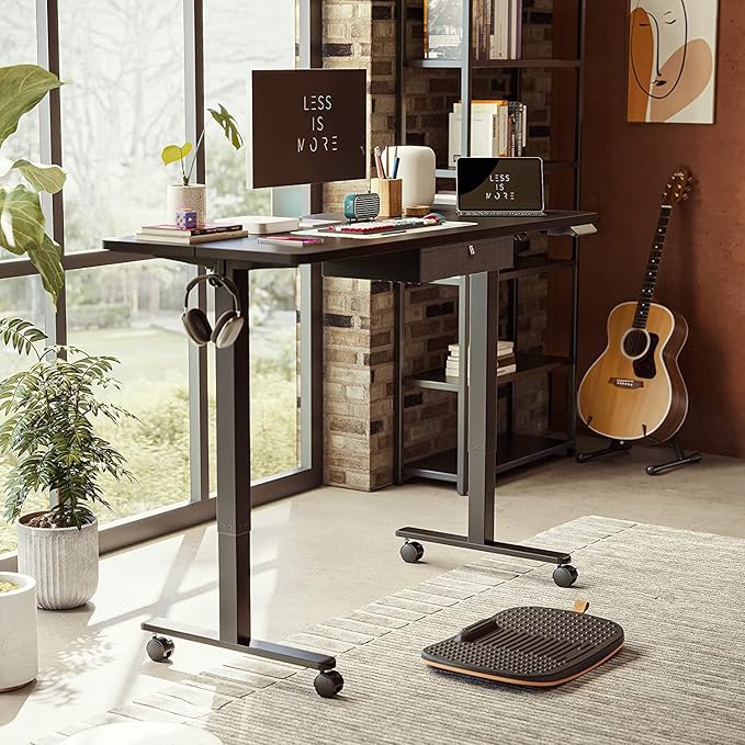 FEZIBO 55x 24 Inches Standing Desk with Drawer, Adjustable Height Electric Stand up Desk with Storage, Sit Stand Home Office Desk, Ergonomic Computer Desk, Black