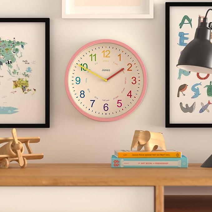 JONES CLOCKS® Kids Wall Clock | Small Modern Children’s Clock | 10 inch | Pink | Colourful Numbers | Learn to Tell The time