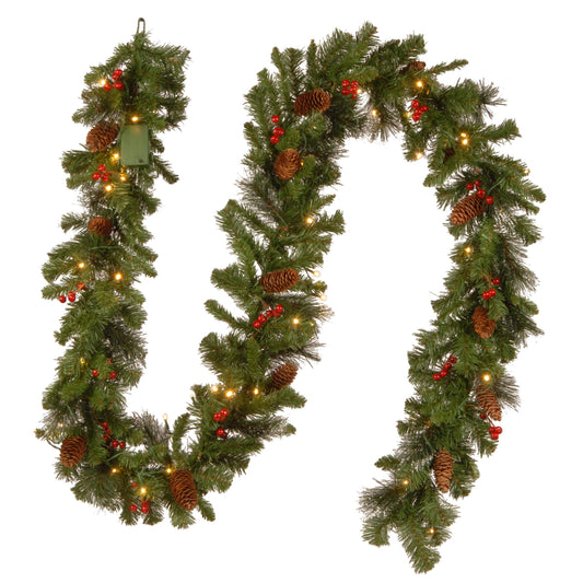 National Tree Company Pre-Lit Artificial Christmas Garland, Green, Crestwood Spruce, White Lights, Decorated with Glitter, Pinecones, Berry Clusters, Battery Operated, Christmas Collection, 9 Feet